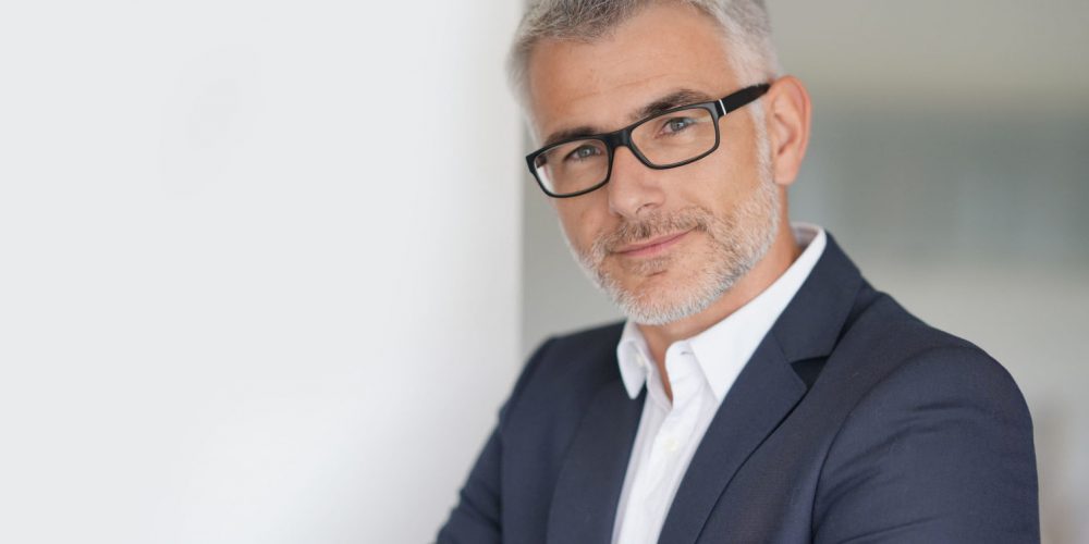 Businessman in grey suit, isolated Businessman in grey suit, isolated