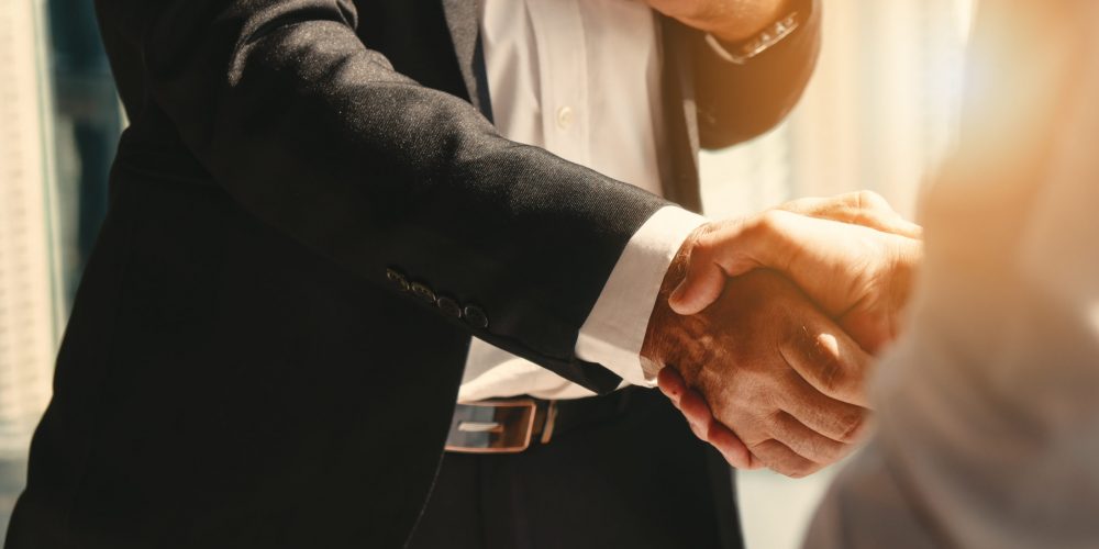 business background of businessman having handshake text text text